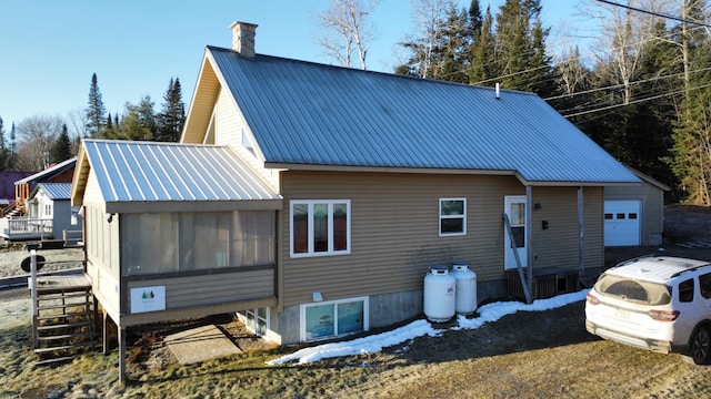 rear view of house with a sunroom