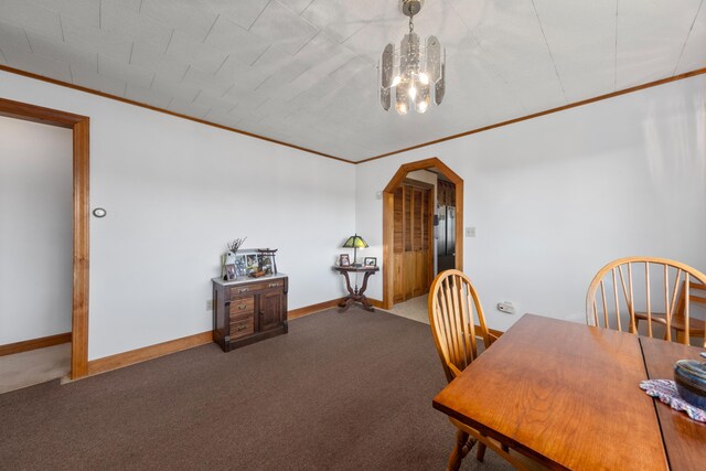 19 Branch Brook Rd, Thomaston, ME 04861 - carpeted dining space featuring ornamental molding, a chandelier, and arched walkways