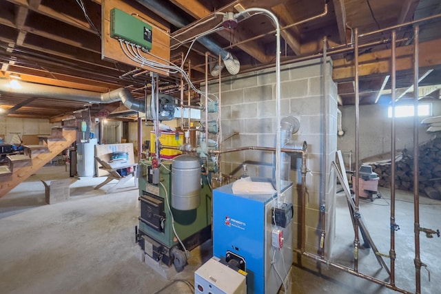 19 Branch Brook Rd, Thomaston, ME 04861 - basement featuring water heater, a heating unit, and stairs