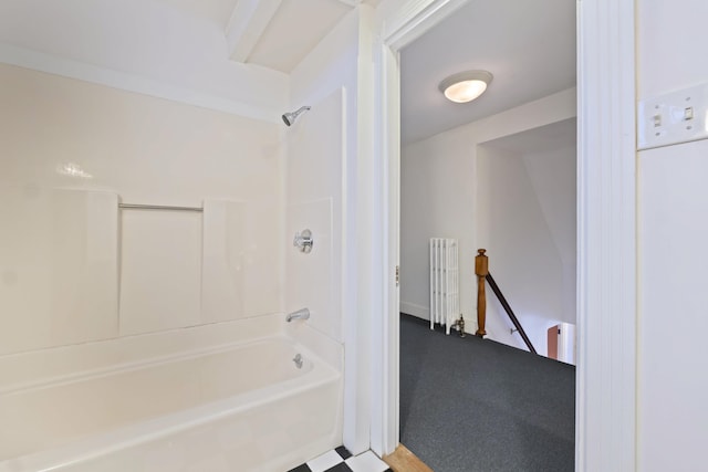 bathroom featuring shower / bathing tub combination and radiator