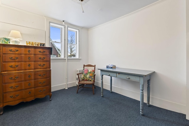 sitting room with dark carpet and ornamental molding