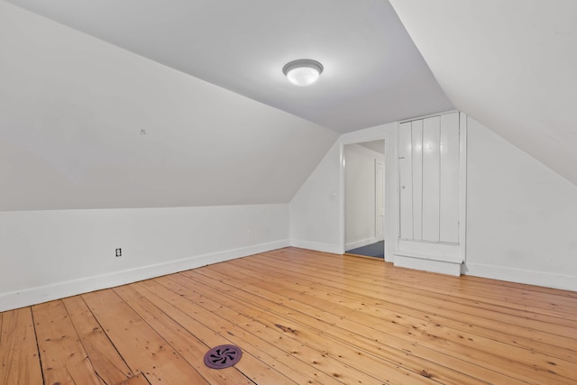 bonus room featuring light hardwood / wood-style flooring and lofted ceiling