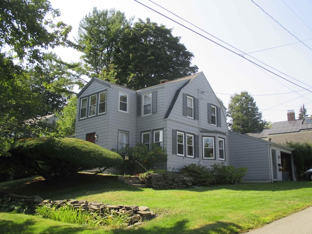 view of front of home with a front lawn