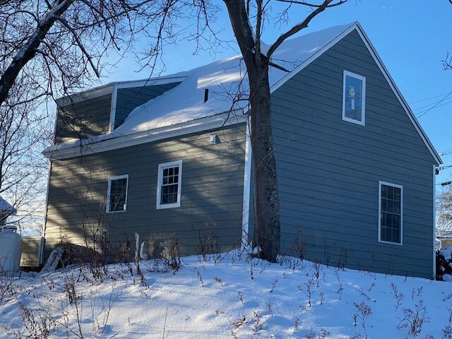 view of snow covered property