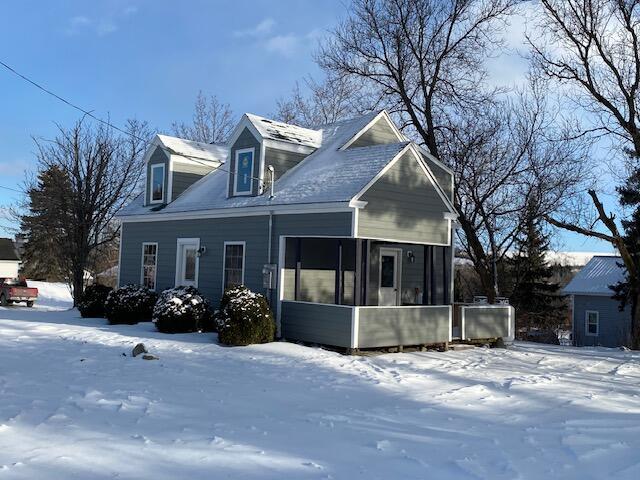 view of front facade featuring a sunroom