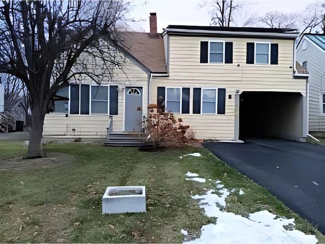 view of front facade with a front lawn and a garage