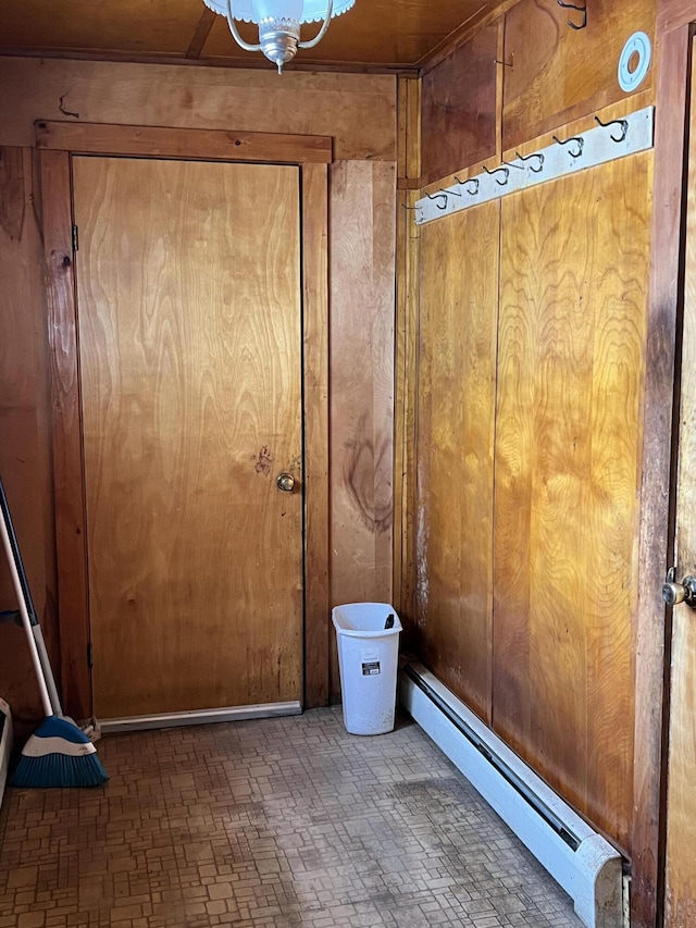 doorway featuring a baseboard heating unit