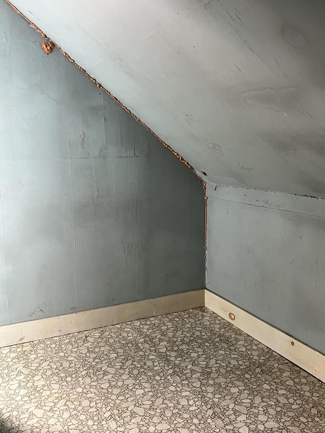 90 Canada Rd, Moscow, ME 04920 - additional living space with lofted ceiling and baseboards