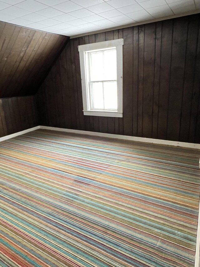 90 Canada Rd, Moscow, ME 04920 - bonus room featuring carpet flooring, wood walls, and lofted ceiling