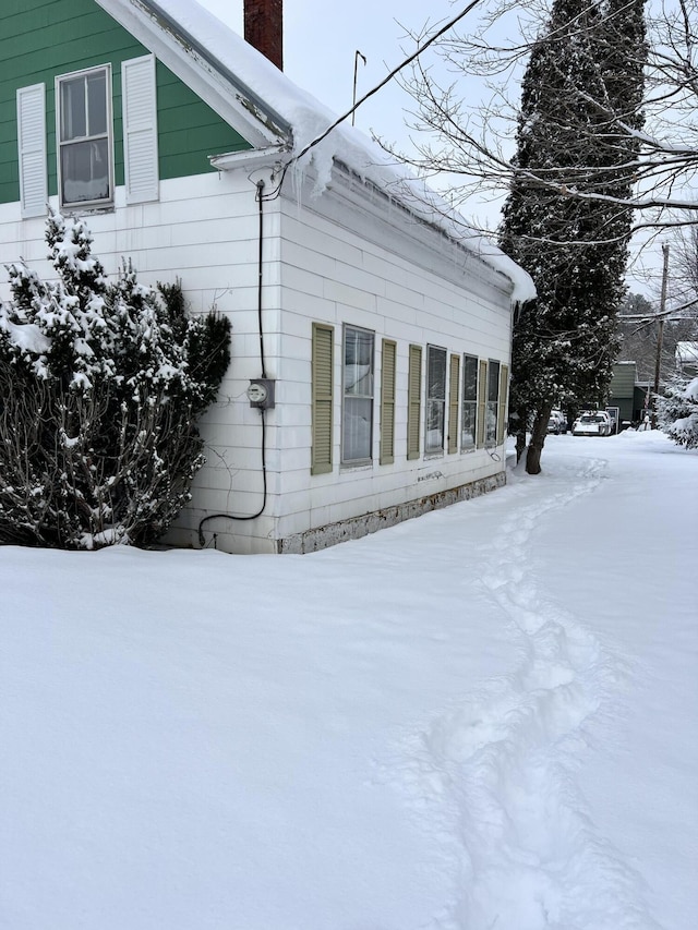 view of snow covered property