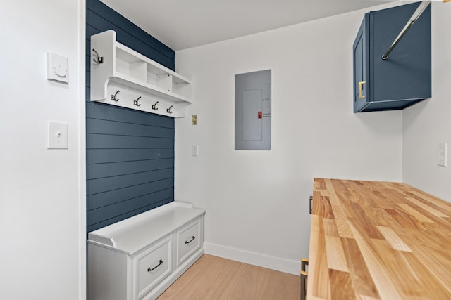 mudroom featuring electric panel and light wood-type flooring