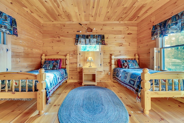 bedroom featuring hardwood / wood-style flooring, wooden ceiling, and wood walls