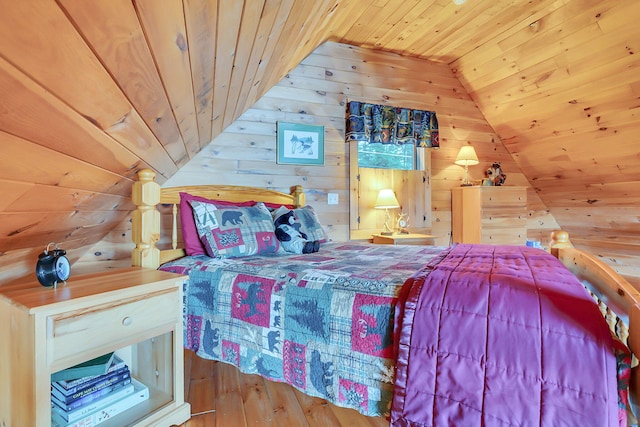 bedroom featuring hardwood / wood-style floors, lofted ceiling, wooden walls, and wooden ceiling