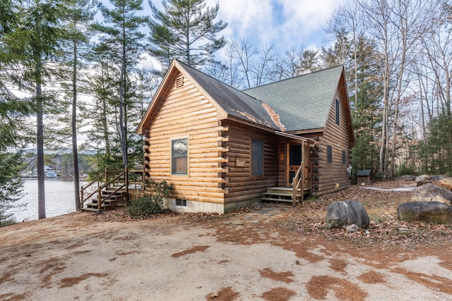 view of property exterior with a water view