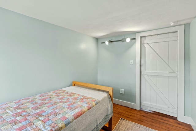 bedroom featuring hardwood / wood-style floors