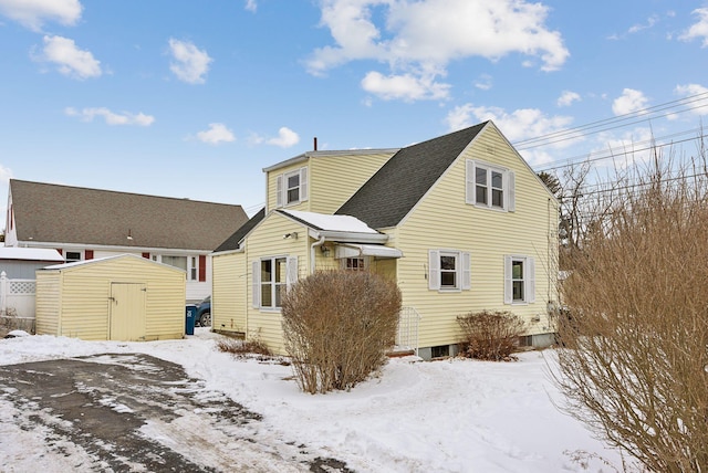 view of front of house with a shed