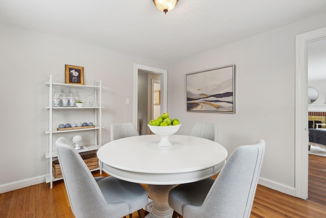 dining room with hardwood / wood-style floors