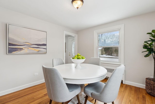 dining room with light hardwood / wood-style flooring