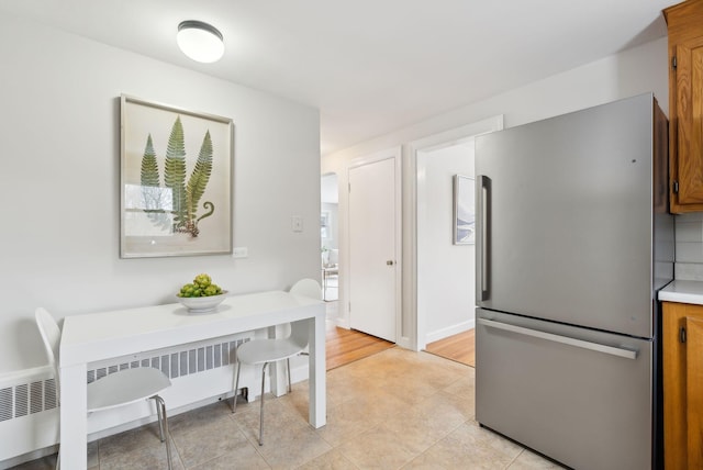 tiled dining space with radiator