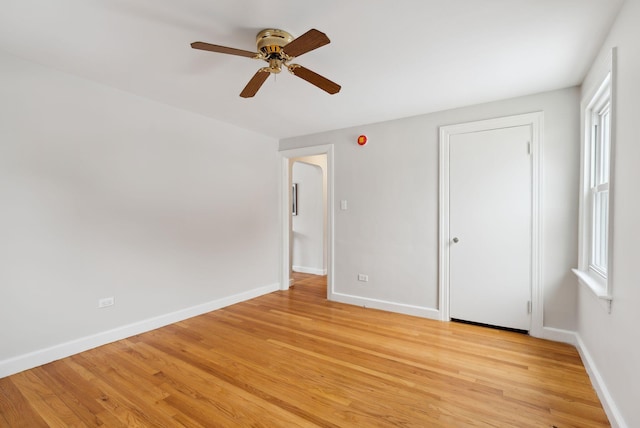 unfurnished bedroom featuring ceiling fan and light hardwood / wood-style flooring