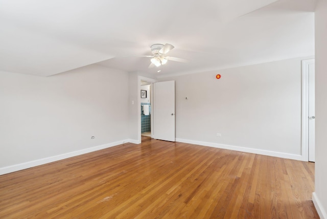 spare room featuring ceiling fan and light wood-type flooring