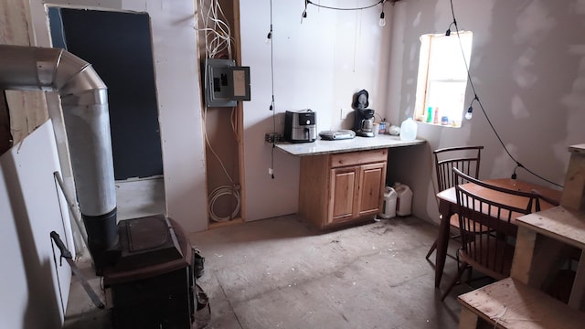 kitchen featuring decorative light fixtures and electric panel