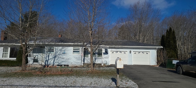 single story home featuring a garage