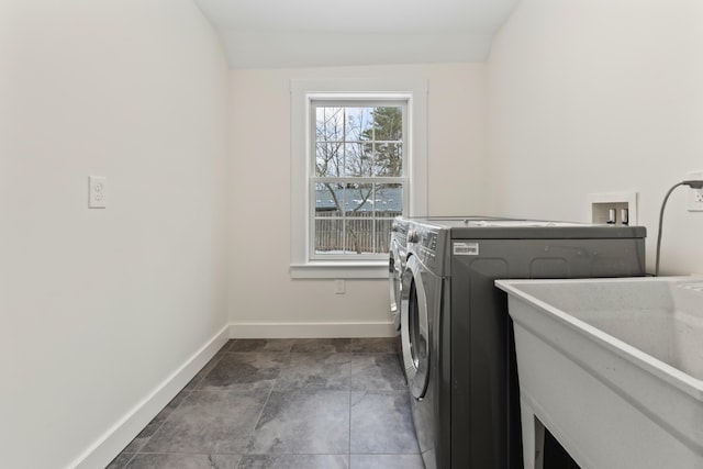 laundry area featuring sink and washing machine and clothes dryer