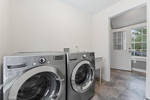 laundry room featuring washing machine and dryer