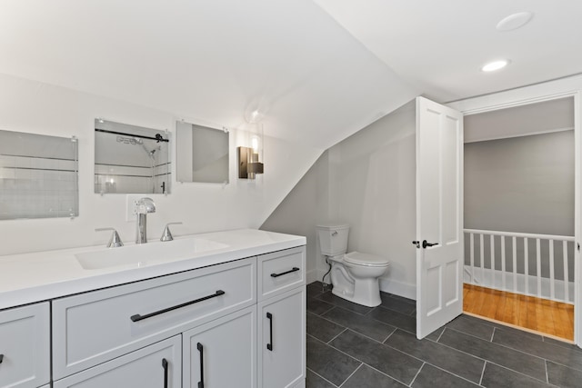 bathroom with hardwood / wood-style flooring, vanity, and toilet