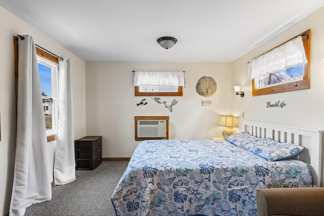 carpeted bedroom with a wall unit AC