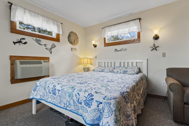 bedroom with dark colored carpet, a wall unit AC, and multiple windows