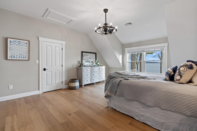 18 Sheehans Island Rd, Raymond, ME 04071 - bedroom featuring light wood finished floors and vaulted ceiling