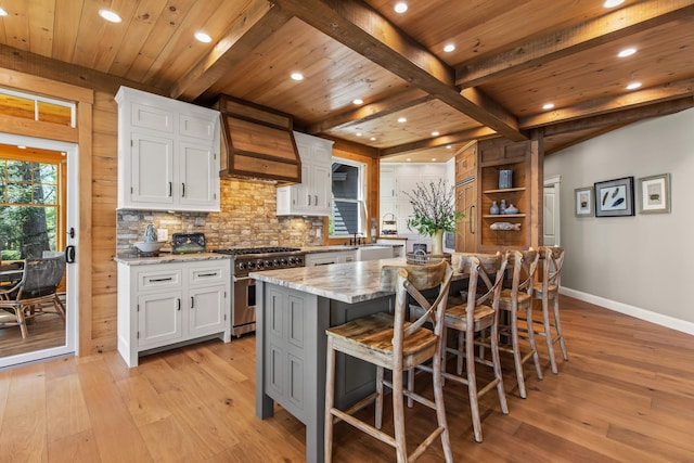 18 Sheehans Island Rd, Raymond, ME 04071 - kitchen featuring stainless steel stove, recessed lighting, light wood-style flooring, baseboards, and white cabinets