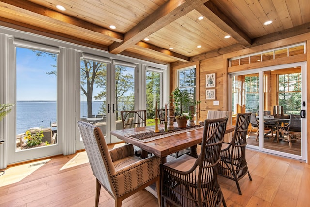 18 Sheehans Island Rd, Raymond, ME 04071 - dining space with french doors, light wood-type flooring, a water view, beam ceiling, and recessed lighting