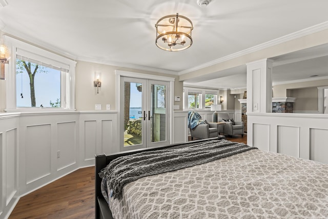 18 Sheehans Island Rd, Raymond, ME 04071 - bedroom featuring dark wood-style flooring, a chandelier, access to exterior, a decorative wall, and crown molding