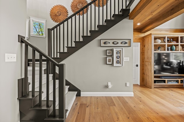 18 Sheehans Island Rd, Raymond, ME 04071 - staircase featuring baseboards and wood-type flooring