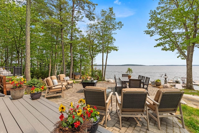 18 Sheehans Island Rd, Raymond, ME 04071 - wooden terrace featuring a water view, a patio area, and an outdoor hangout area