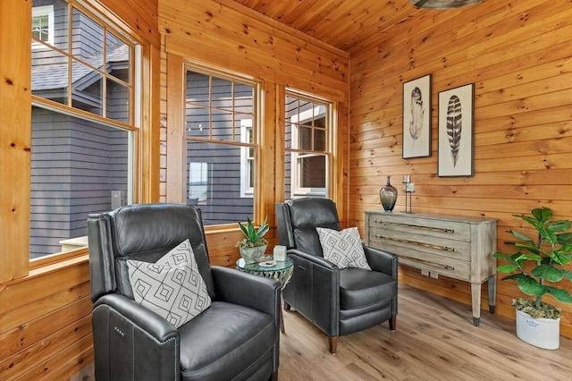 18 Sheehans Island Rd, Raymond, ME 04071 - sitting room featuring wooden walls, wood finished floors, and wooden ceiling