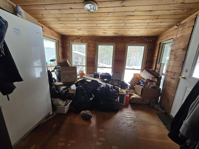 interior space featuring wood-type flooring, wooden walls, and wooden ceiling