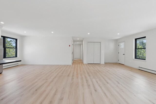 17 Ward Rd, Sebago, ME 04029 - unfurnished living room featuring recessed lighting, plenty of natural light, and light wood-type flooring