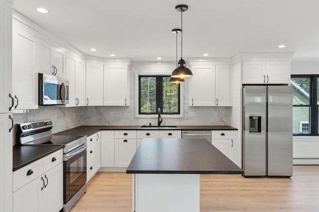 17 Ward Rd, Sebago, ME 04029 - kitchen featuring appliances with stainless steel finishes, a sink, white cabinets, and dark countertops