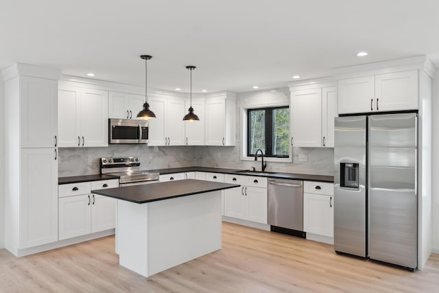 17 Ward Rd, Sebago, ME 04029 - kitchen featuring a sink, dark countertops, recessed lighting, and stainless steel appliances
