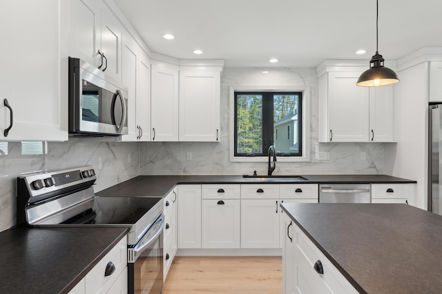 17 Ward Rd, Sebago, ME 04029 - kitchen featuring appliances with stainless steel finishes, a sink, and dark countertops