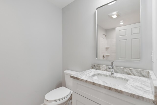 17 Ward Rd, Sebago, ME 04029 - full bathroom with toilet, vanity, and walk in shower