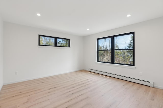 17 Ward Rd, Sebago, ME 04029 - empty room featuring baseboard heating, light wood-style floors, plenty of natural light, and recessed lighting