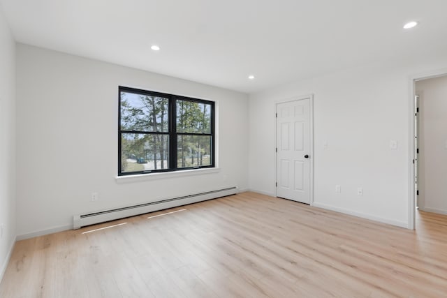 17 Ward Rd, Sebago, ME 04029 - empty room featuring a baseboard radiator, light wood finished floors, recessed lighting, and baseboards