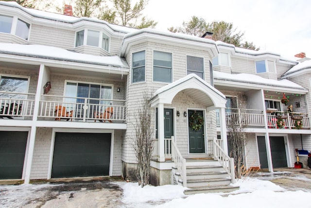 135 Vernon St Unit 4E, Bethel, ME 04217 - multi unit property featuring a chimney, an attached garage, a balcony, and driveway
