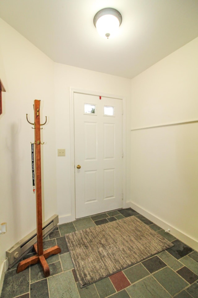 135 Vernon St Unit 4E, Bethel, ME 04217 - foyer entrance with a baseboard radiator and dark stone finish floors