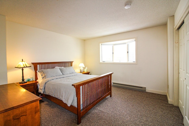 carpeted bedroom featuring a textured ceiling, baseboard heating, and a closet